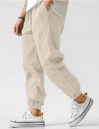 Owen | Męskie luźne lniane spodnie dresowe, spodnie zwężane przy kostce | Erwnn | Niebieski